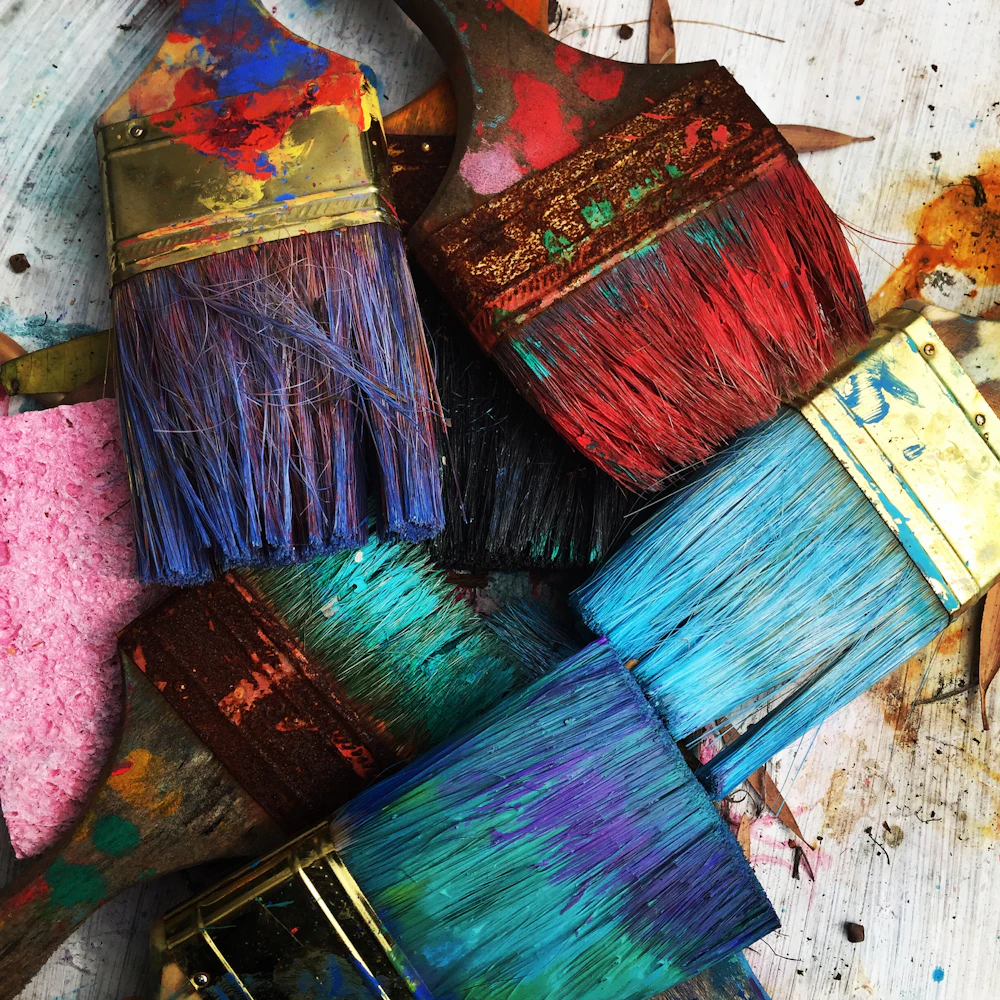 Art tools and brushes arranged on a studio worktable